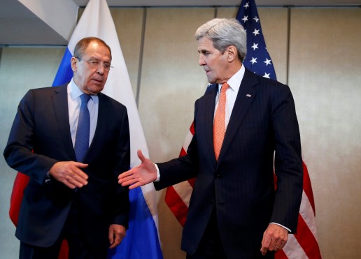 U.S. Foreign Secretary John Kerry and Russian Foreign Minister Sergei Lavrov (L) go for a handshake before their bilateral talks in Munich, Germany, February 11, 2016, ahead of the International Syria Support Group (ISSG) meeting. REUTERS/Michael Dalder