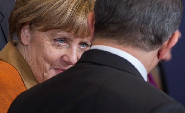 German Chancellor Angela Merkel talks with Turkish Prime Minister Ahmet Davutoglu during a EU-Turkey summit in Brussels